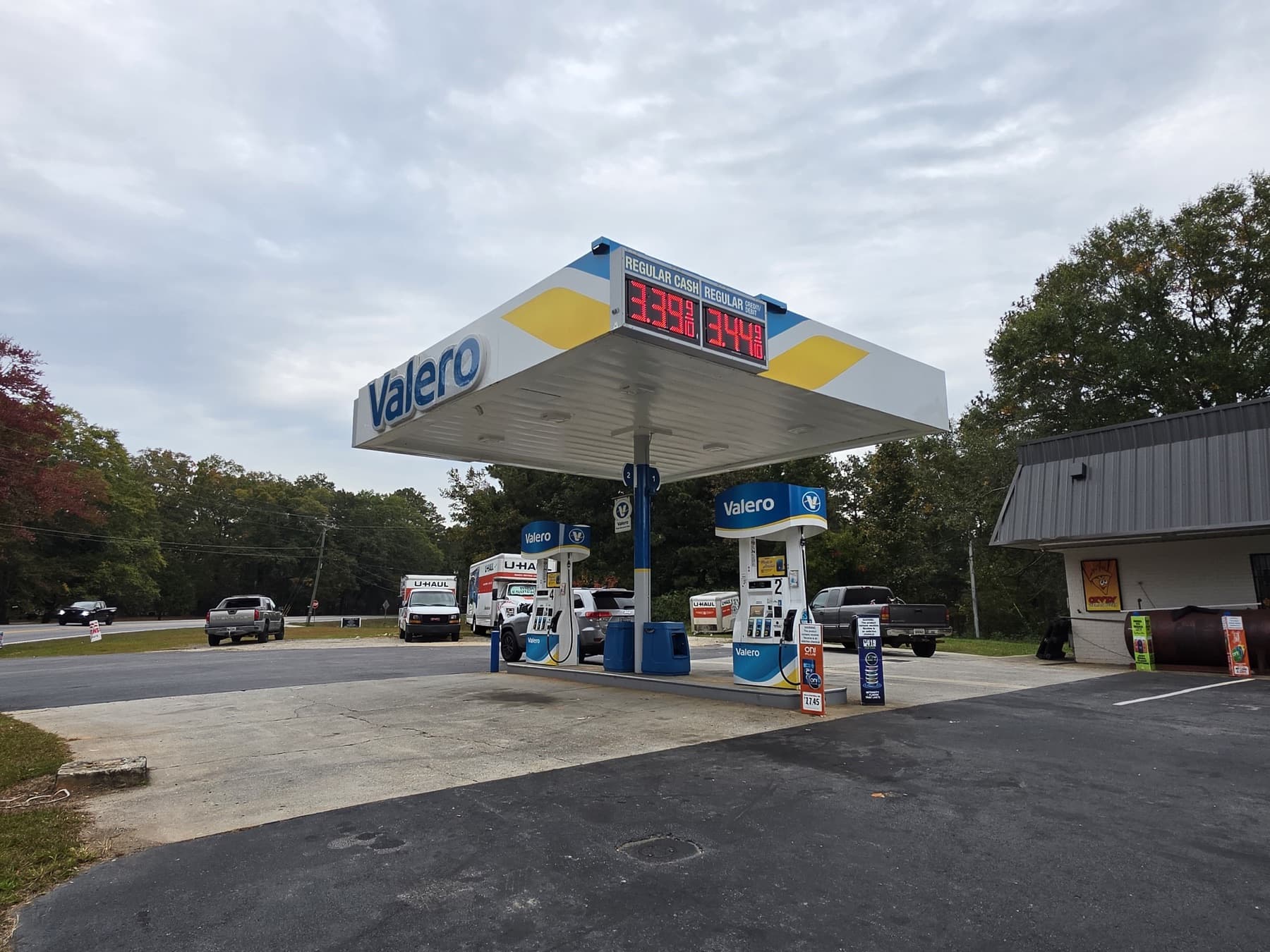 Valero pumps at Speedy Spot on GA-113 in Carrollton, GA, with U-Haul trucks parked behind